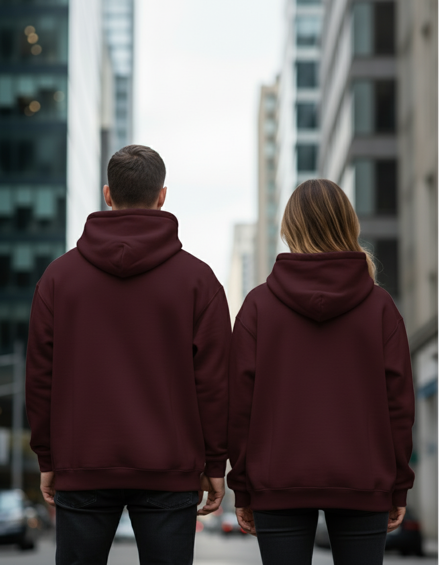 Back view of couple in burgundy oversized hoodies