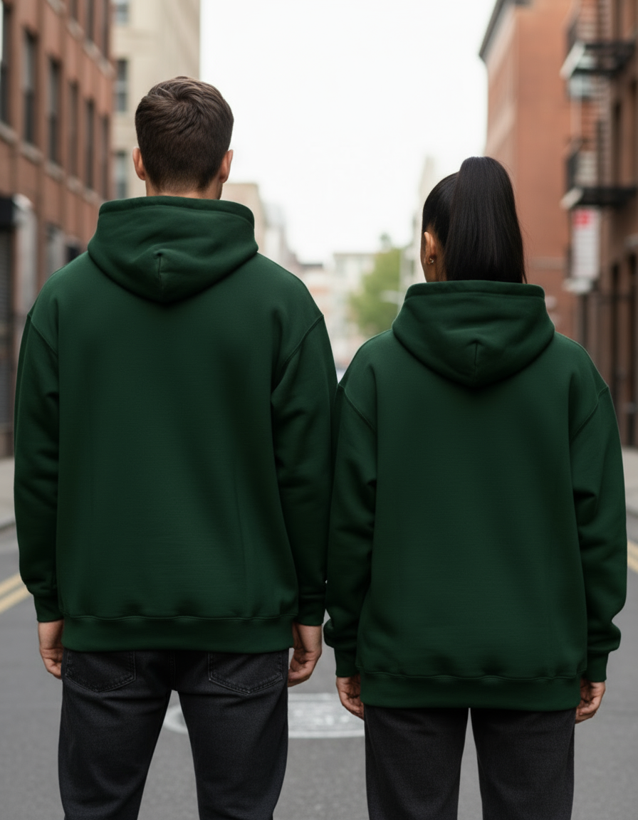 Back view of couple in dark green oversized hoodies